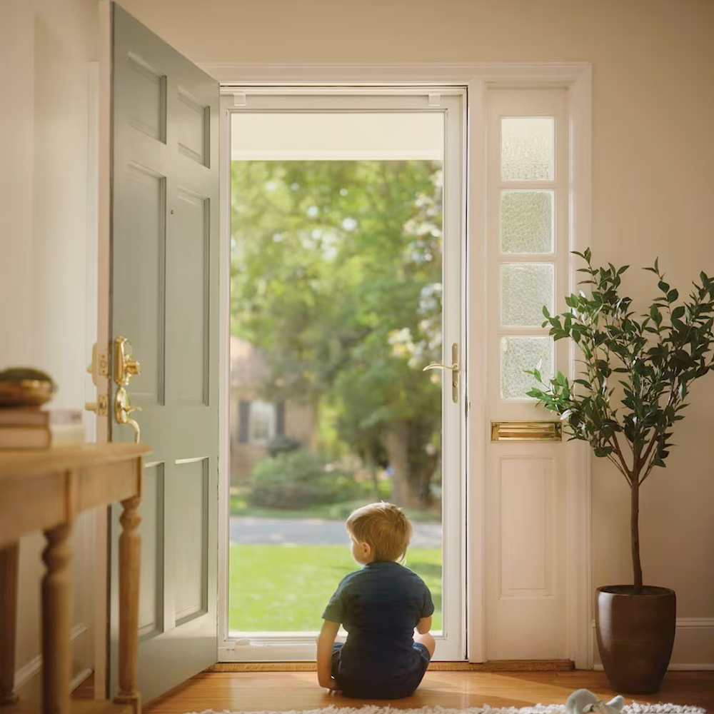 Close-up of storm door hardware and frame detail