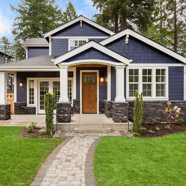 Front entry featuring a premium Therma-Tru door and decorative glass